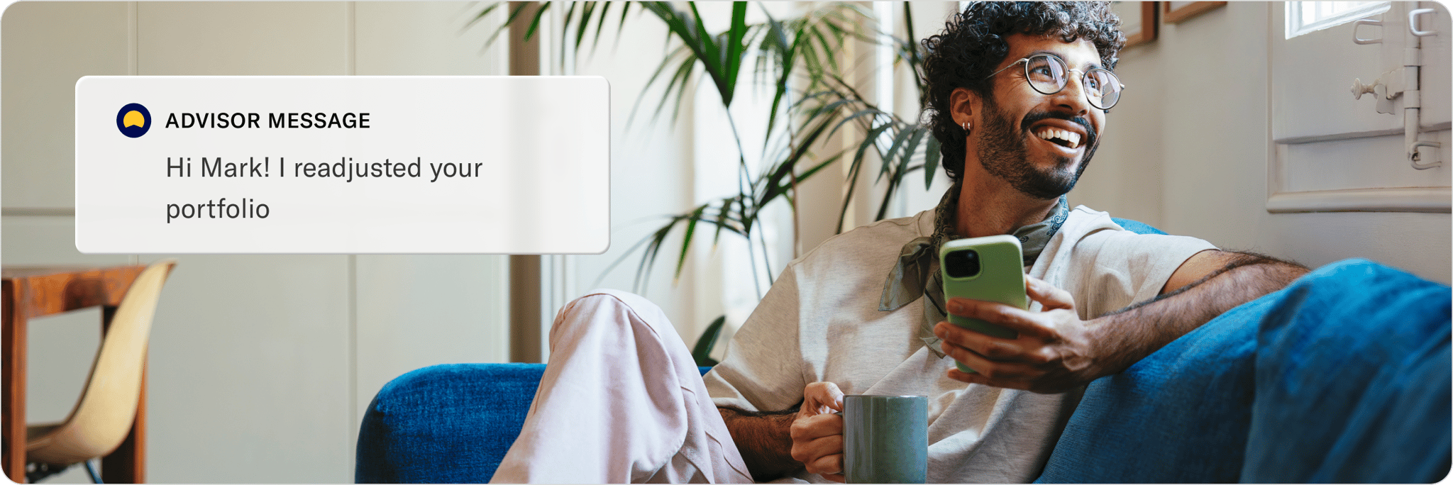 Two people chatting on a sofa with coffee